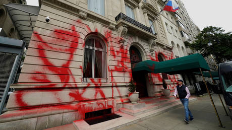 FILE PHOTO. A man walks past the Russian consulate in New York on September 30, 2022 after it vandalized with red spray paint early Friday in an apparent protest as President Vladimir Putin pursues his bloody invasion of Ukraine.