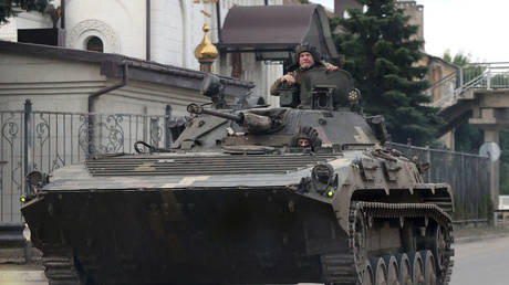 FILE PHOTO: Ukrainian soldiers drive an infantry fighting vehicle