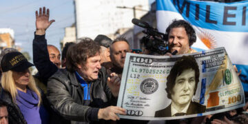 Argentina’s new president begins ‘shock therapy’ by devaluing peso