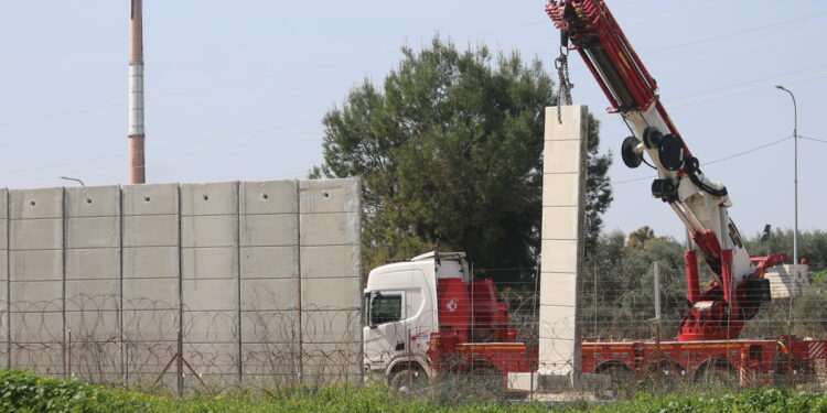 Obscured by the fog of the Gaza war, Palestinians face a different threat