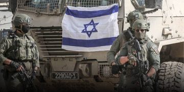 Iran-backed armed group warns of ‘long war’ if US strikes Tehran