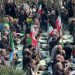 Iranians gather for first Friday prayers during war