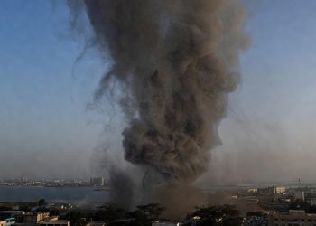 Smoke rising over Manama Bahrain near U.S. Fifth Fleet headquarters following Iranian missile strike February 2026