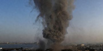 Smoke rising over Manama Bahrain near U.S. Fifth Fleet headquarters following Iranian missile strike February 2026