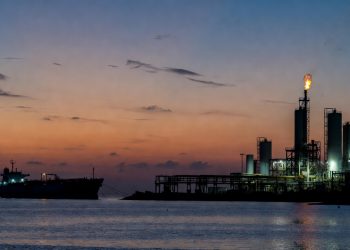 Venezuela Orinoco Belt upgrader terminal with tanker at anchor