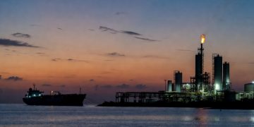 Venezuela Orinoco Belt upgrader terminal with tanker at anchor