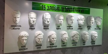 Candace Owens poses with Macron sculpture at SPIEF (PHOTOS)