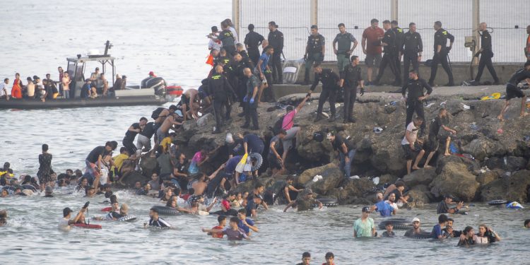 Why did nearly 60,000 migrants suddenly storm the border into Spain?